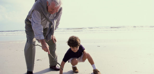 grandfather playing with grandson